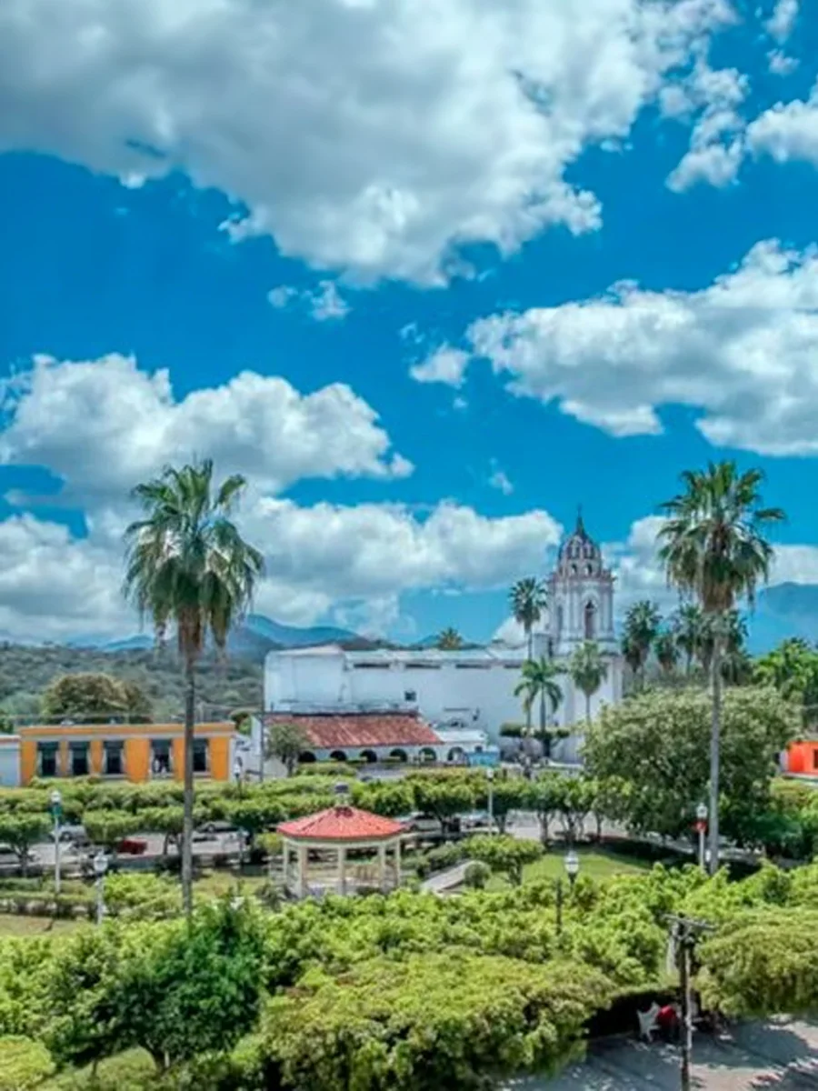 A small square with a kiosk, trees and palm trees in the central square of San Ignacio, Sinaloa